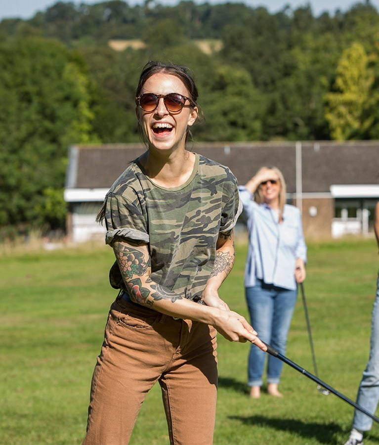 Friendly person playing golf with friends